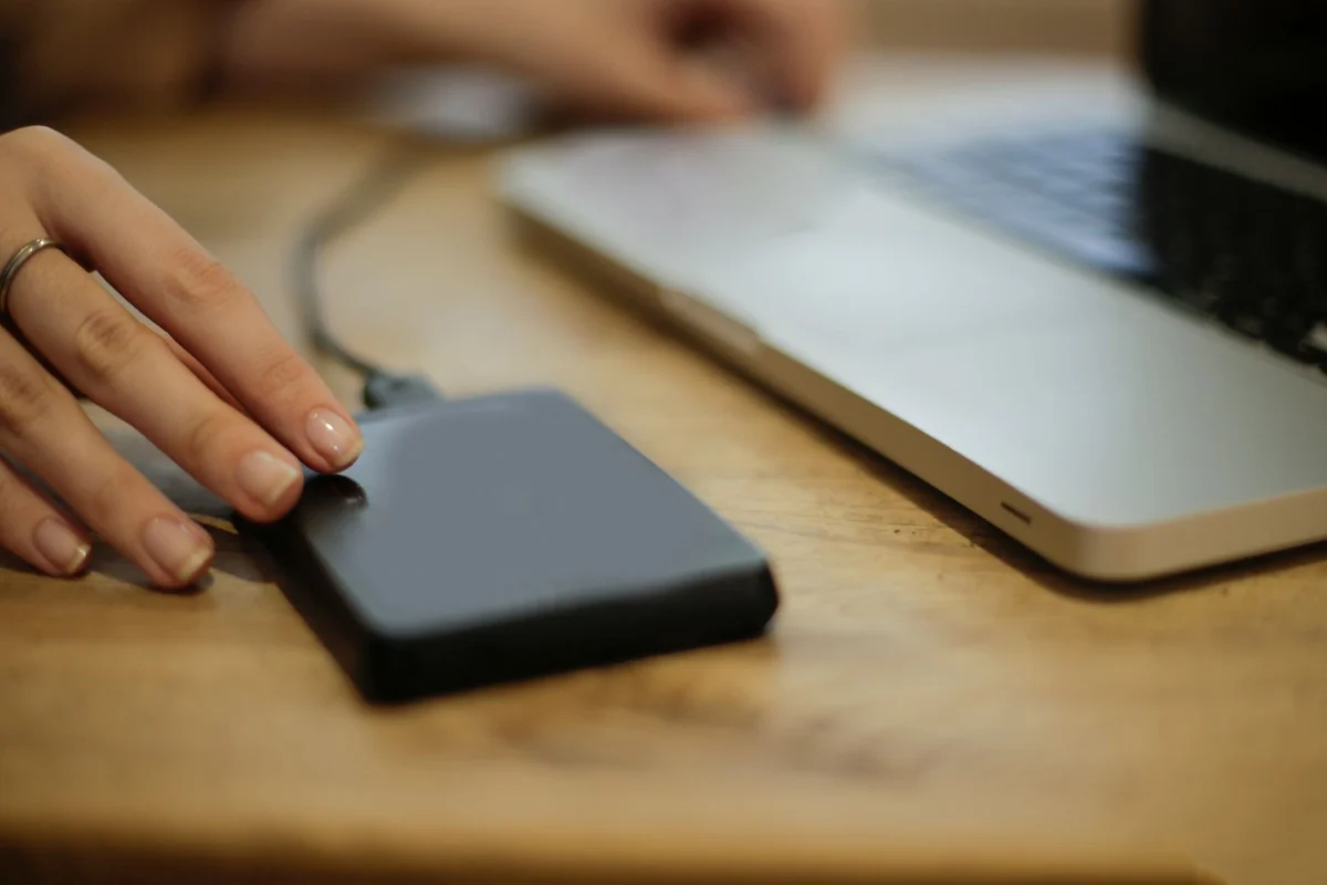 External drive beside a laptop