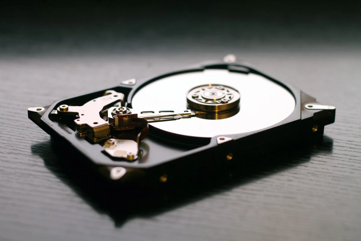 Opened hard drive on a dark surface
