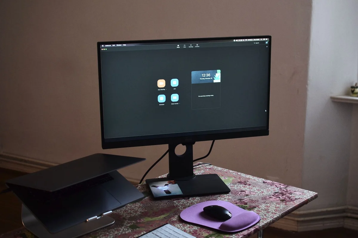 Laptop and separate monitor at a workstation