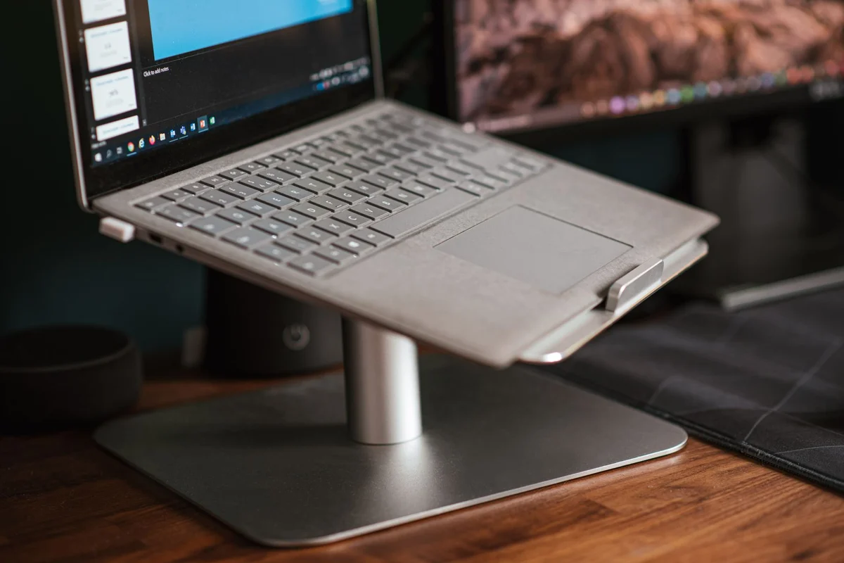 Laptop raised on a metal stand