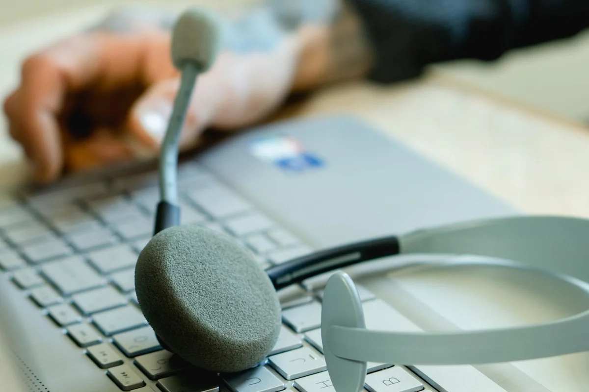 Headset with a microphone on a laptop keyboard