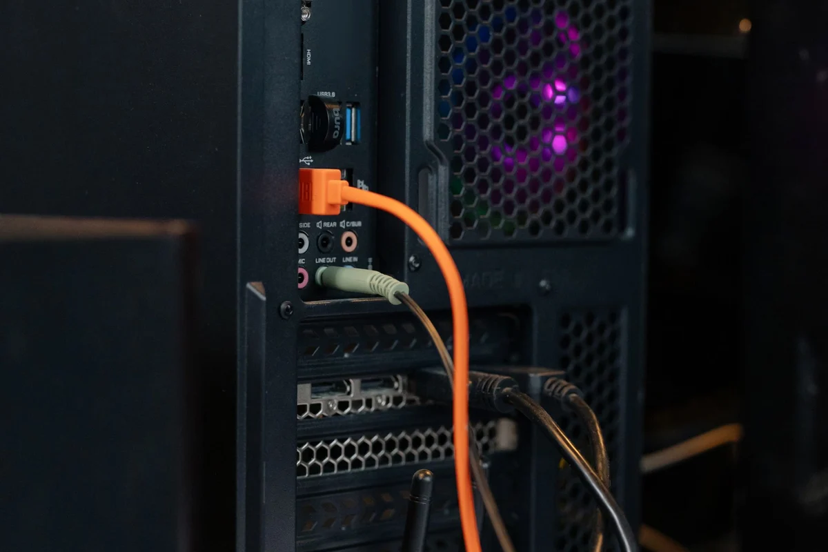 Rear of a desktop PC with connected cables