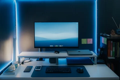 Monitor at an illuminated computer workstation