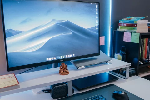 Large monitor and keyboard on a desk