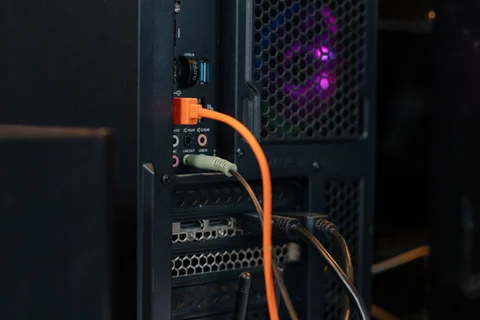 Rear of a desktop PC with connected cables